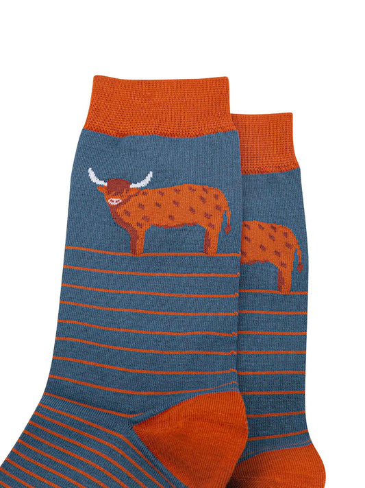 close up of the highland cow on the ankle of the socks, it is designed to like it has a long hairy coat