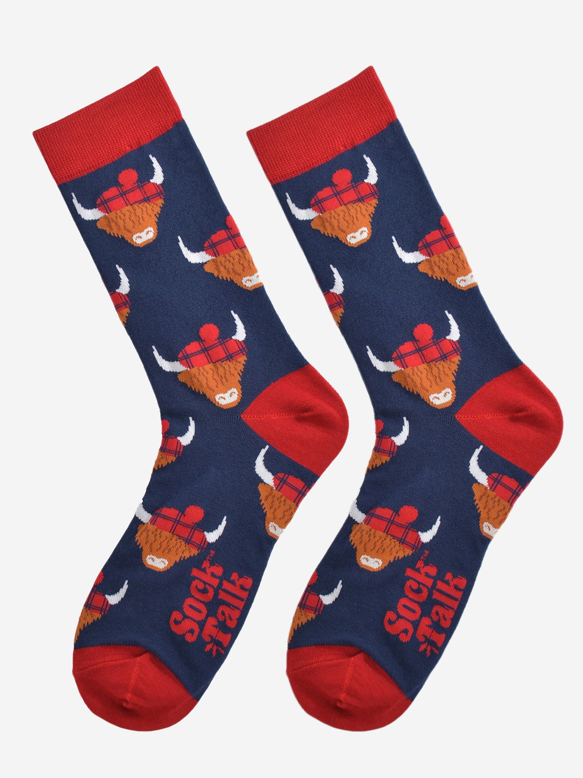 navy blue highland cow bamboo socks laying flat, the highland cows are wearing blue tartan hats