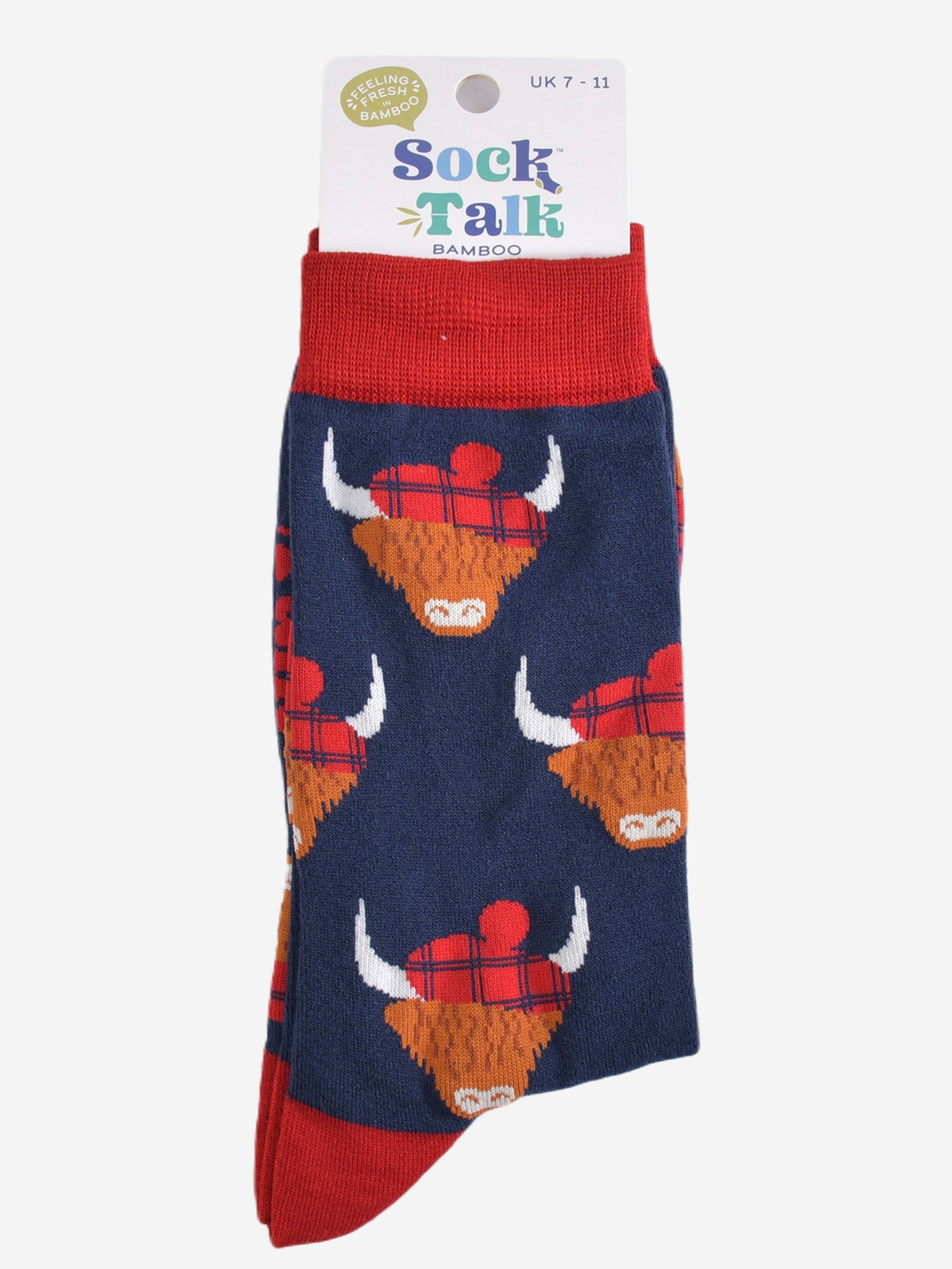 red and navy blue highland cow socks with their sock talk packaging, these socks are uk size 7-11