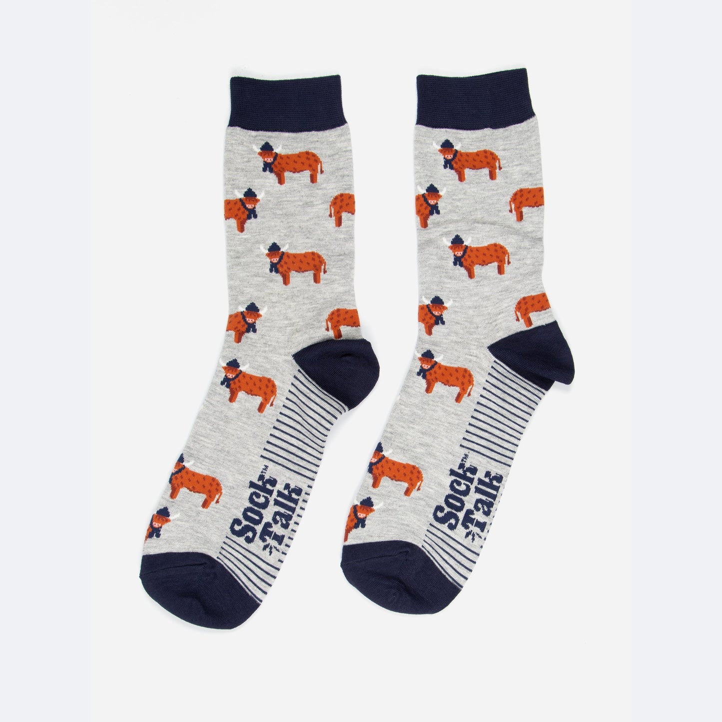 grey and navy blue highland cow bamboo socks laying flat, the highland cows are shown in profile and they are standing up