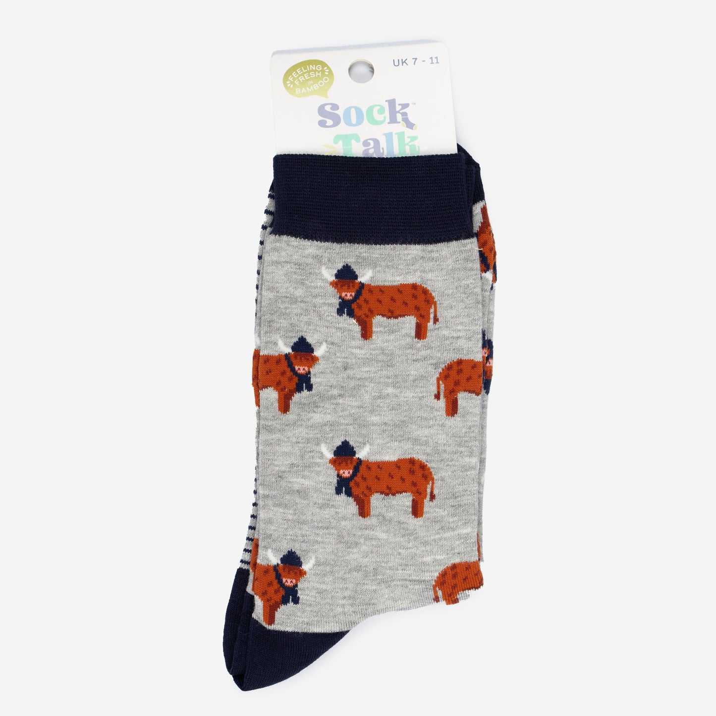 grey and navy blue highland cow bamboo socks in their sock talk packaging, these socks are uk size 7-11