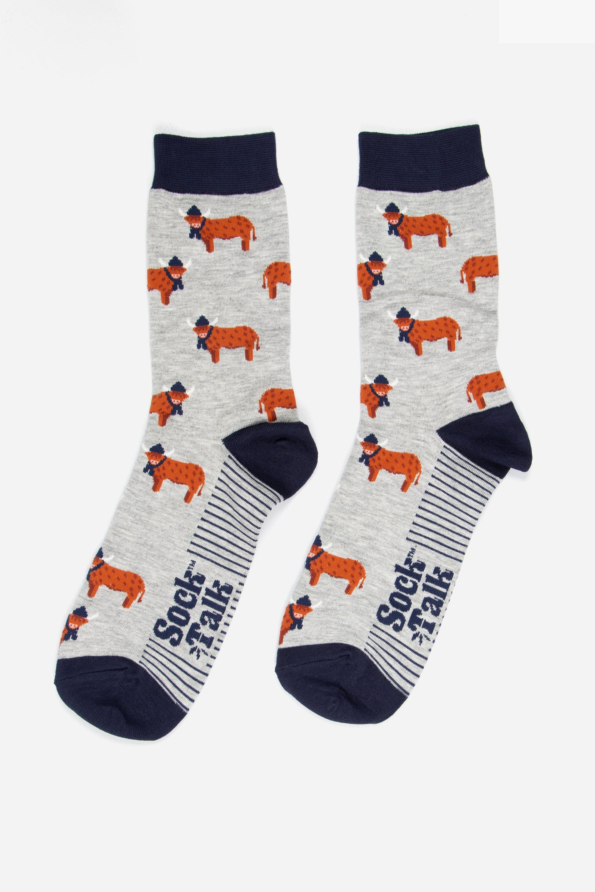 grey and navy blue highland cow bamboo socks laying flat, the highland cows are shown in profile and they are standing up