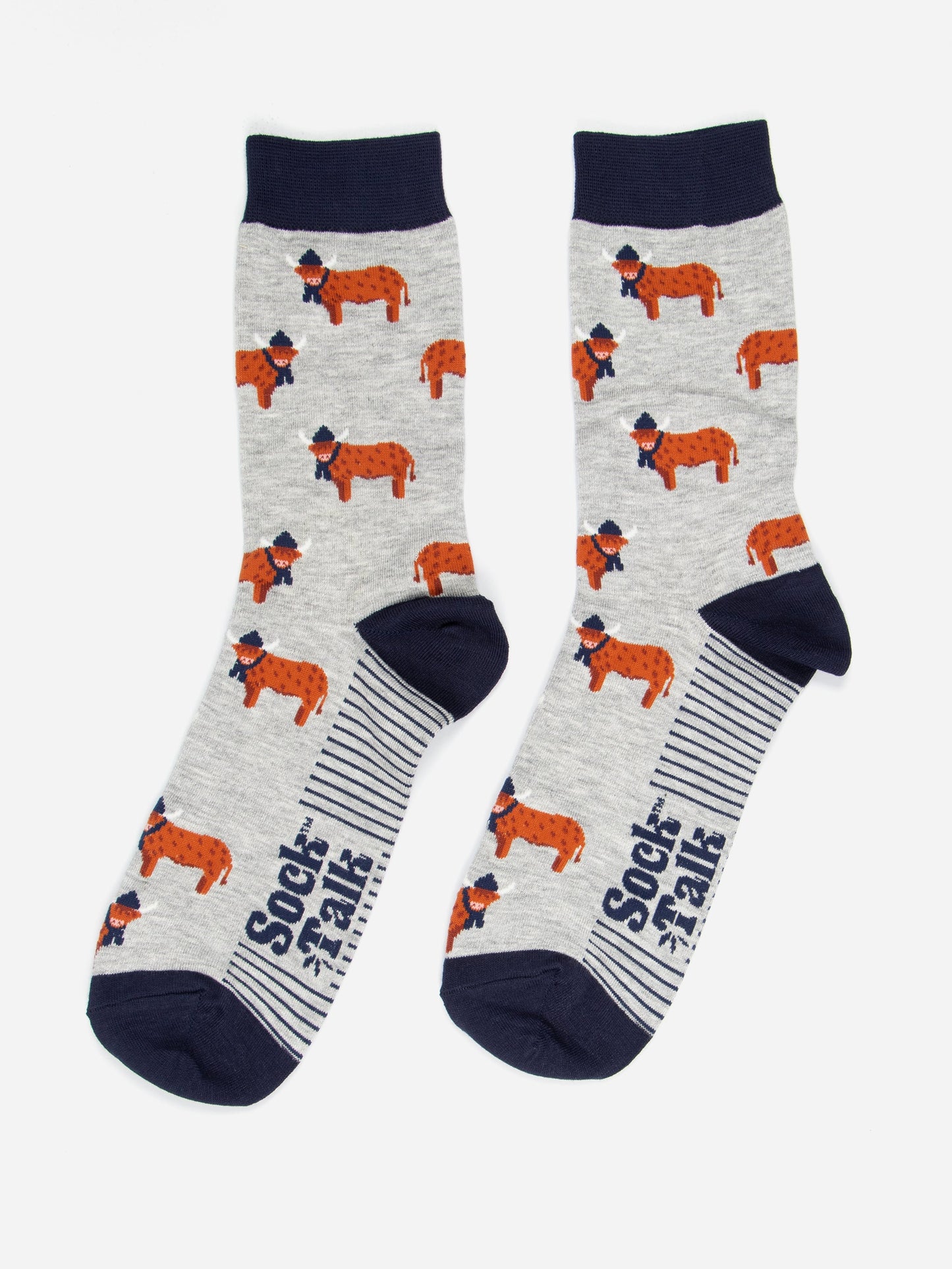 grey and navy blue highland cow bamboo socks laying flat, the highland cows are shown in profile and they are standing up