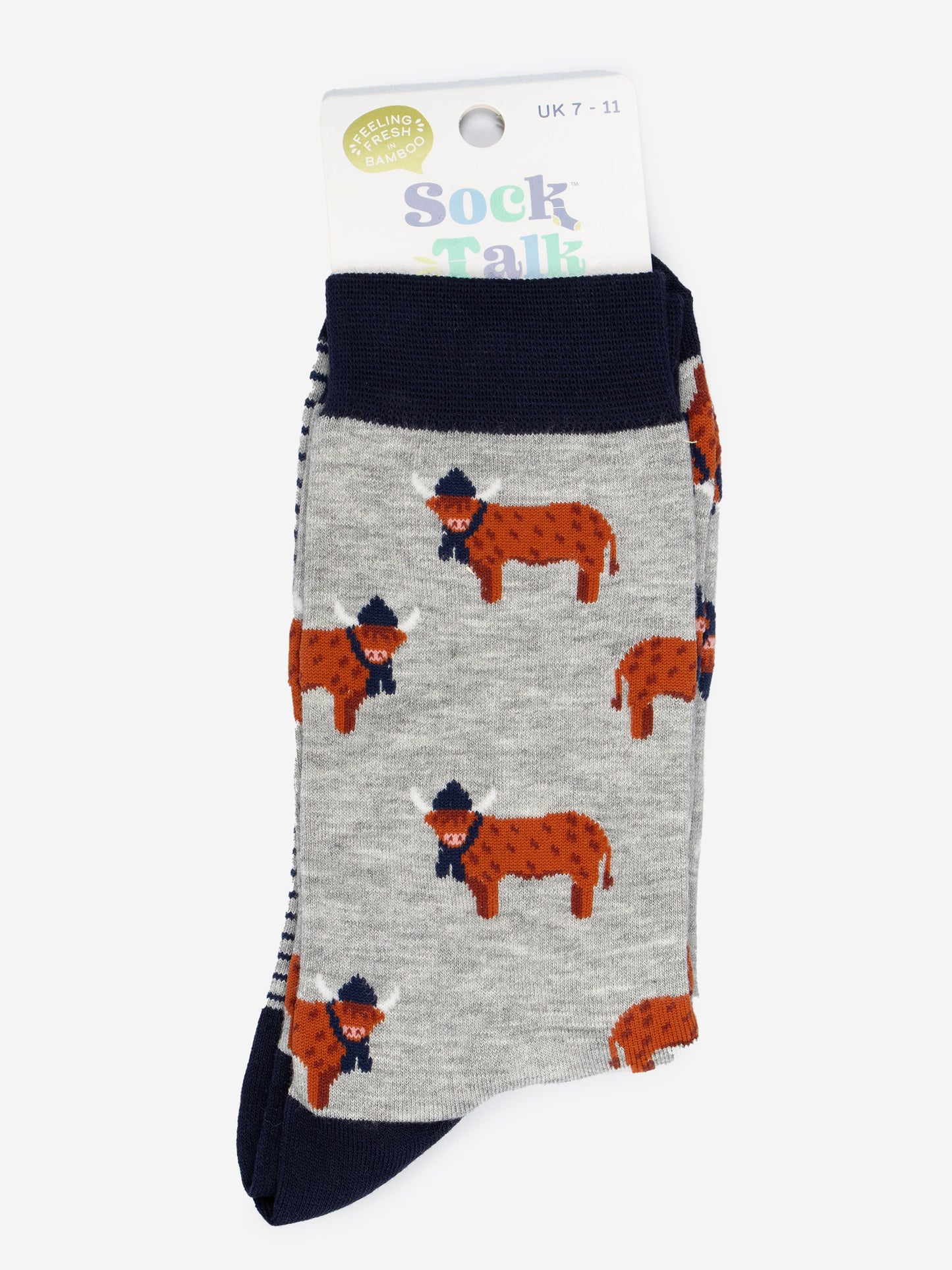 grey and navy blue highland cow bamboo socks in their sock talk packaging, these socks are uk size 7-11