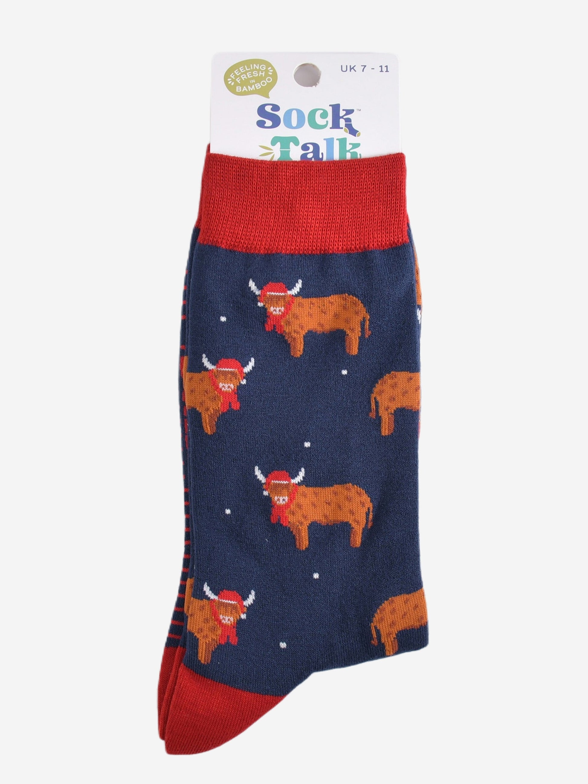 navy blue and red highland cow bamboo socks in their sock talk packaging, these socks are uk size 7-11