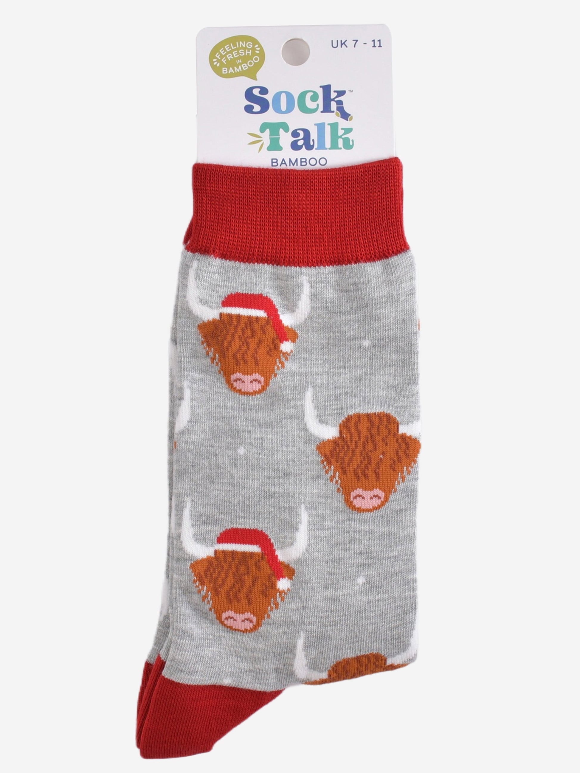 grey and red highland cow santa hat bamboo socks in their sock talk packaging, these socks are uk size 7-11