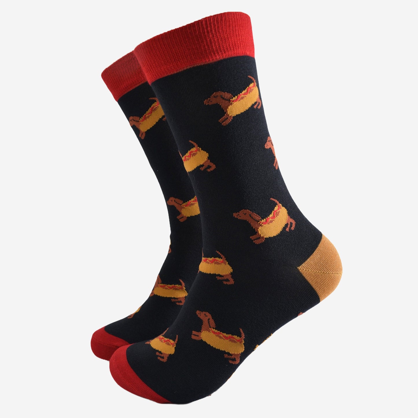 black dress socks with a pattern of sausage dogs wearing hot dog buns