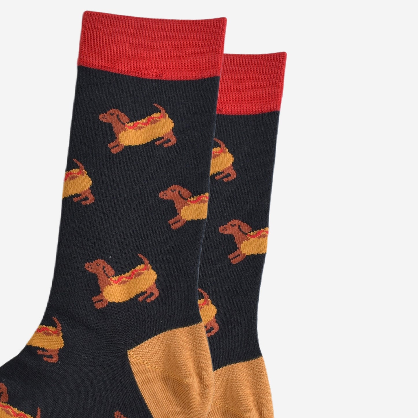 close up of the sausage dogs wearing a hotdog bun on the socks