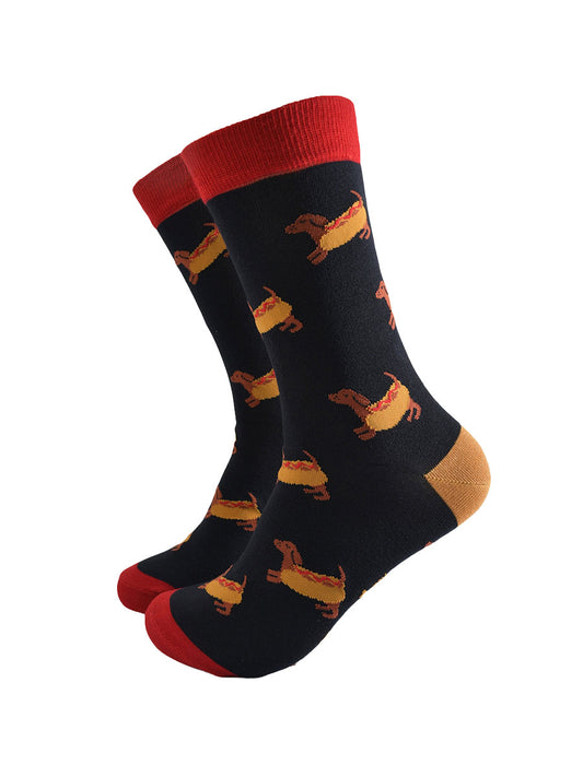 black dress socks with a pattern of sausage dogs wearing hot dog buns
