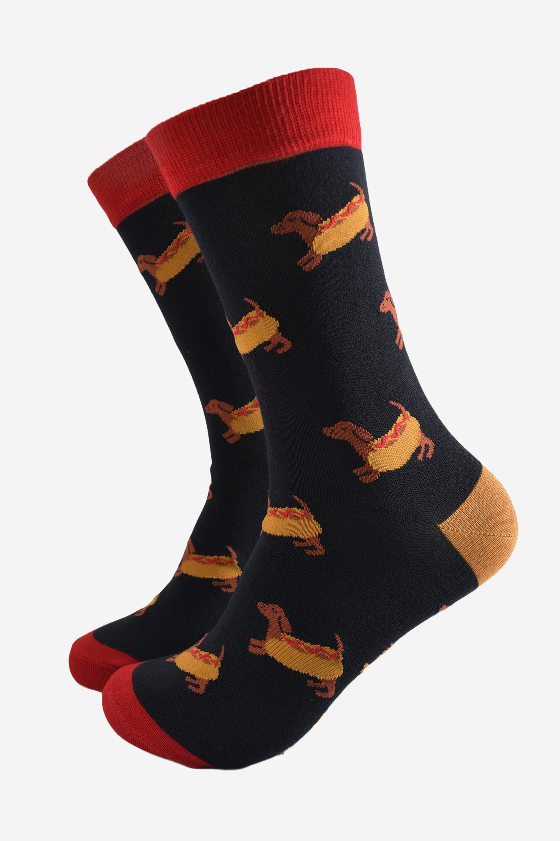 black dress socks with a pattern of sausage dogs wearing hot dog buns