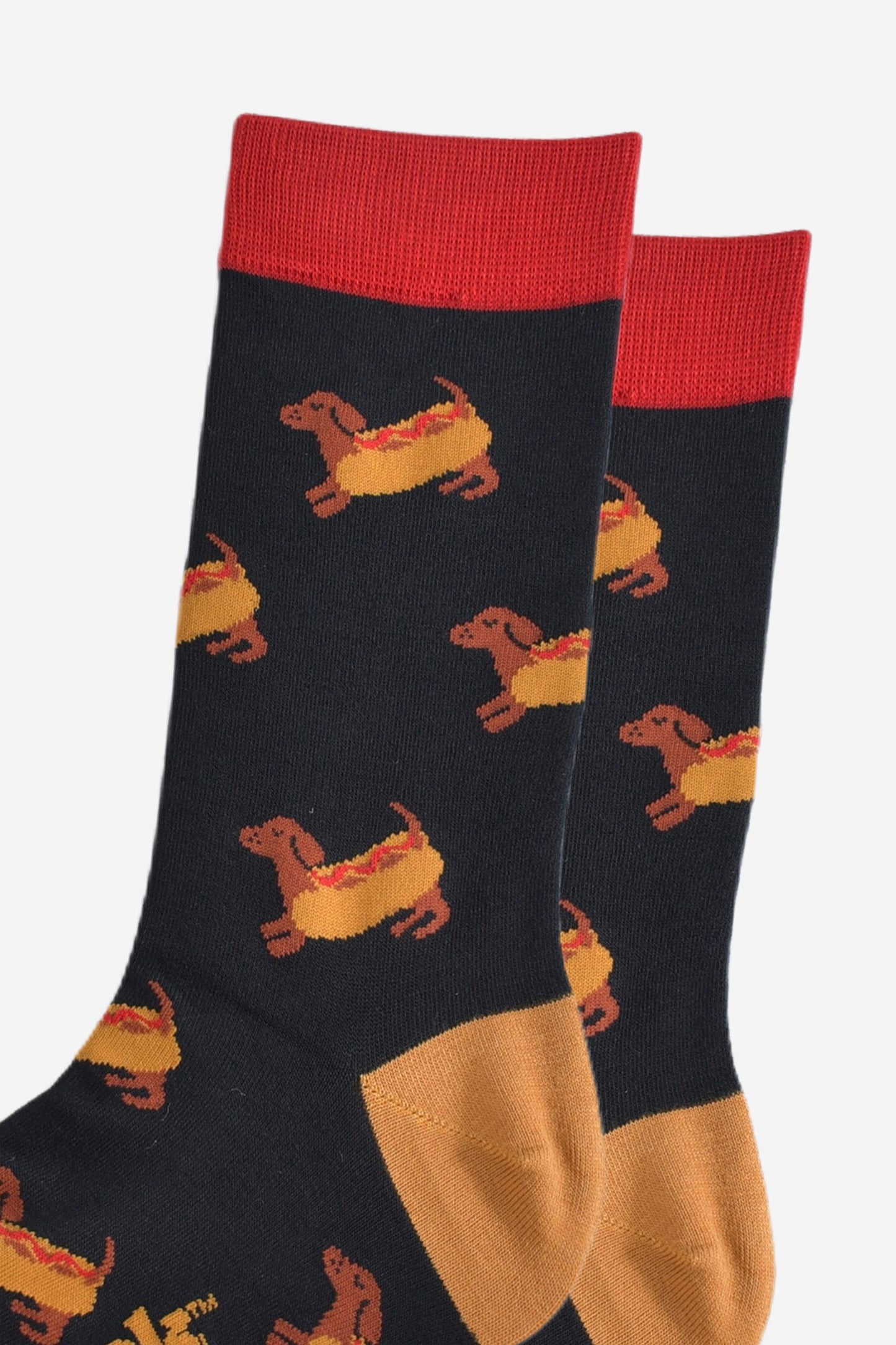 close up of the sausage dogs wearing a hotdog bun on the socks