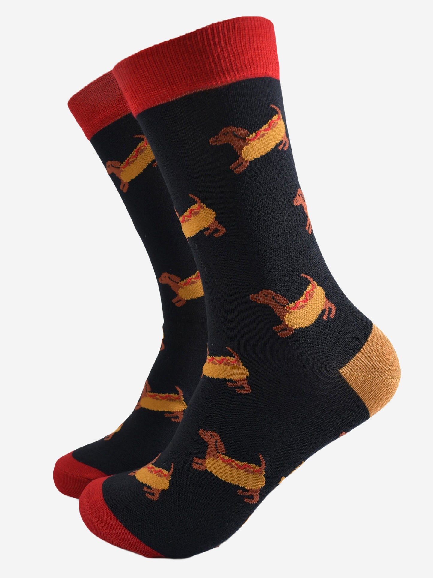 black dress socks with a pattern of sausage dogs wearing hot dog buns