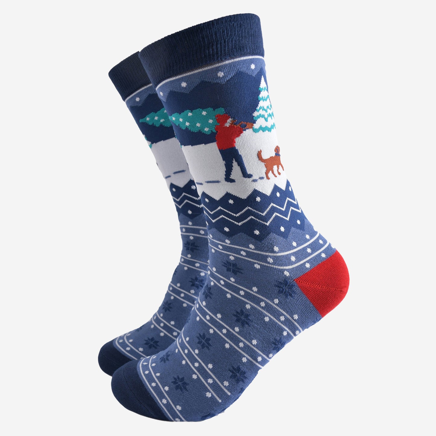 blue fair isle patterned socks featuring a dog walker carrying a xmas tree