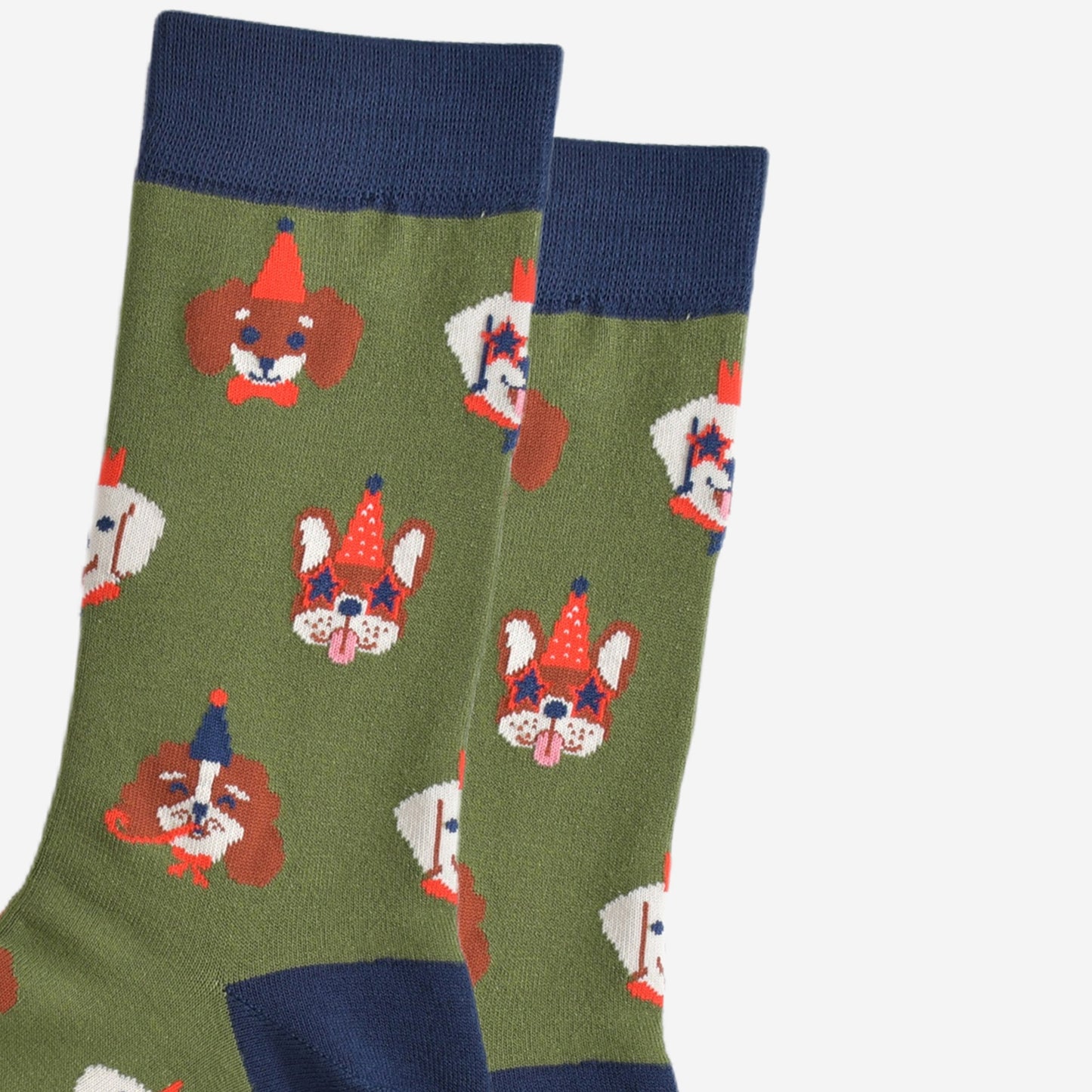 close up of the dog faces on the socks, showing in detail the party hats, glasses and accessories they are wearing