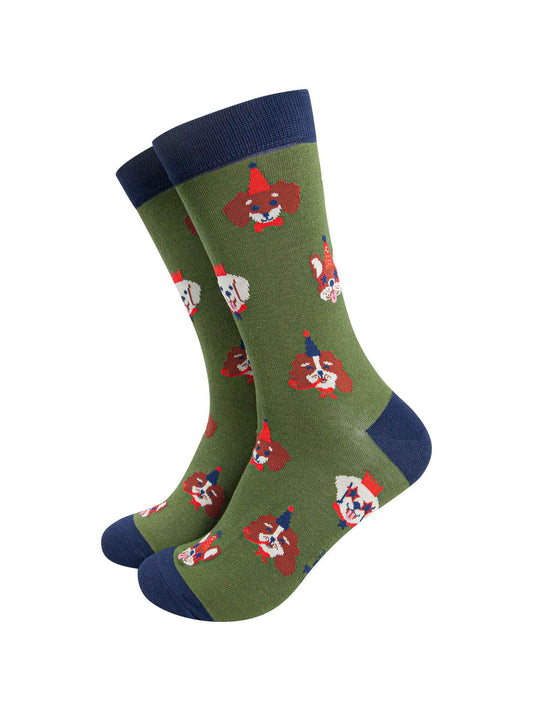 green crew socks with an all over pattern of dogs wearing party hats