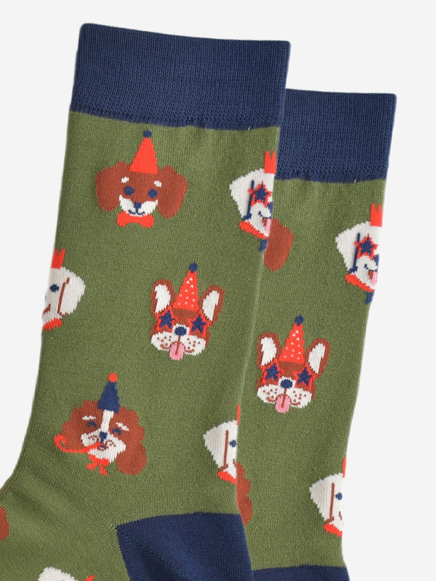 close up of the dog faces on the socks, showing in detail the party hats, glasses and accessories they are wearing