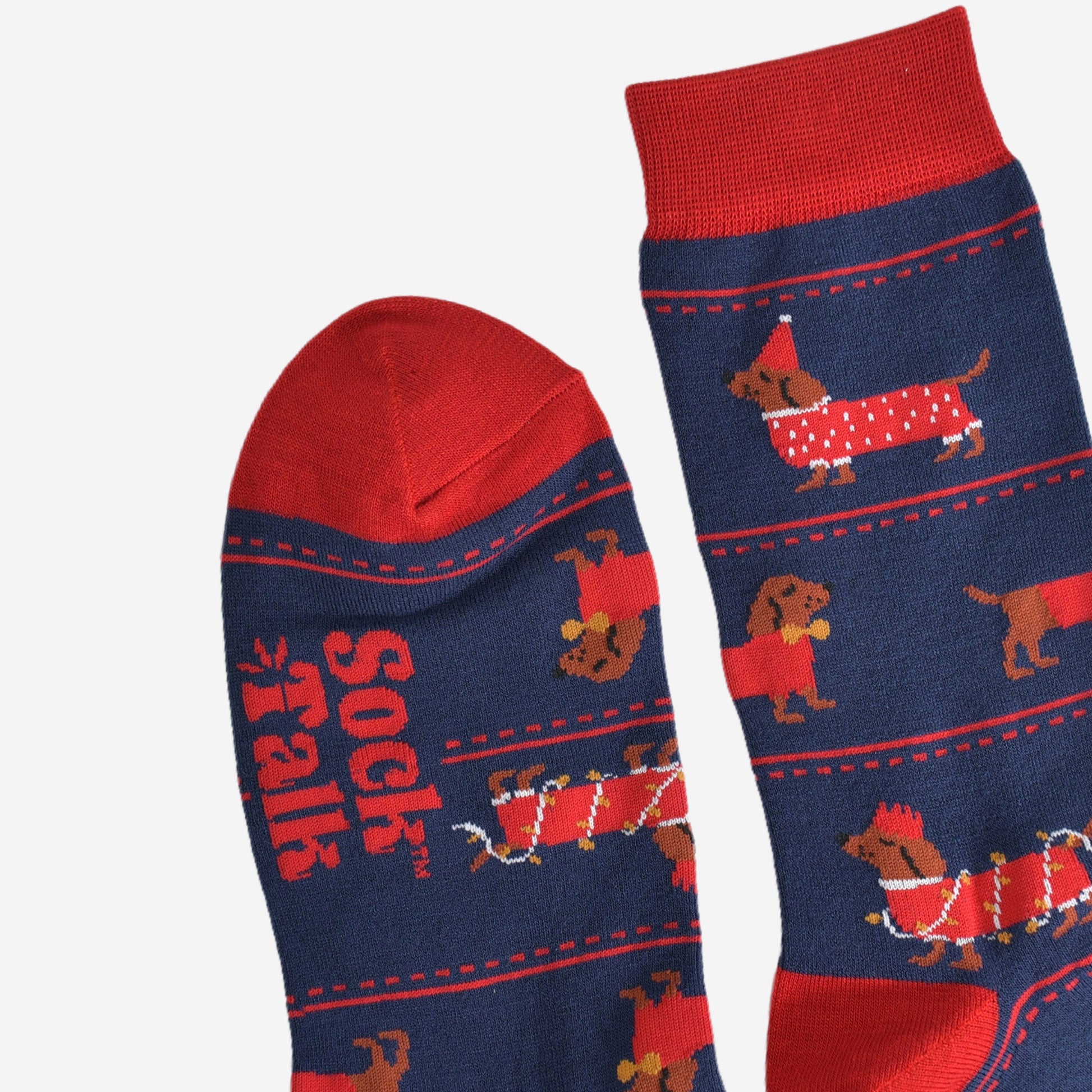 close up of the toe and cuff of the socks, these are red in keeping with the festive party clothing the sausage dogs are wearing, the rest of the socks are navy blue