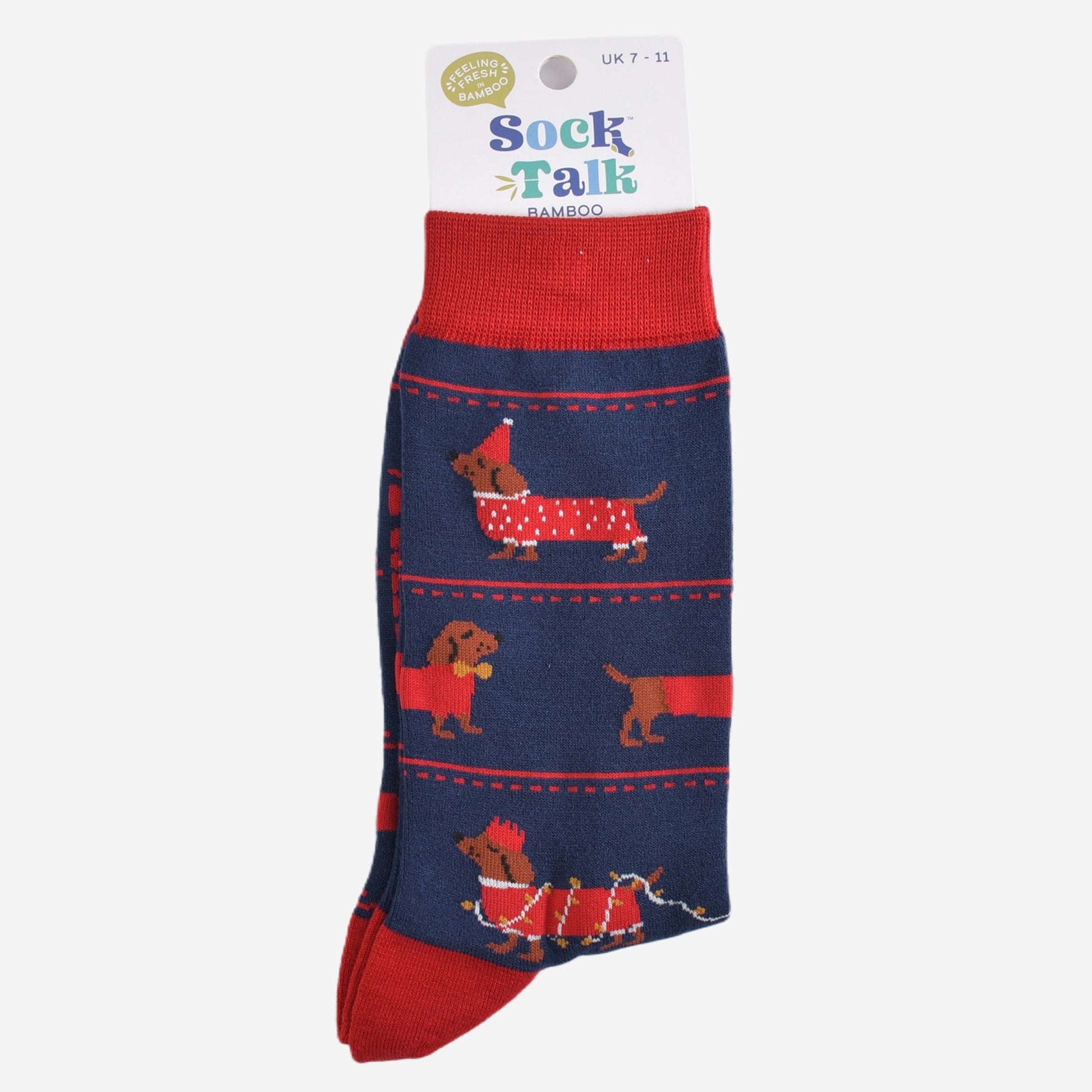 sausage dog party bamboo socks in their sock talk packaging, these socks are a uk size 7-11