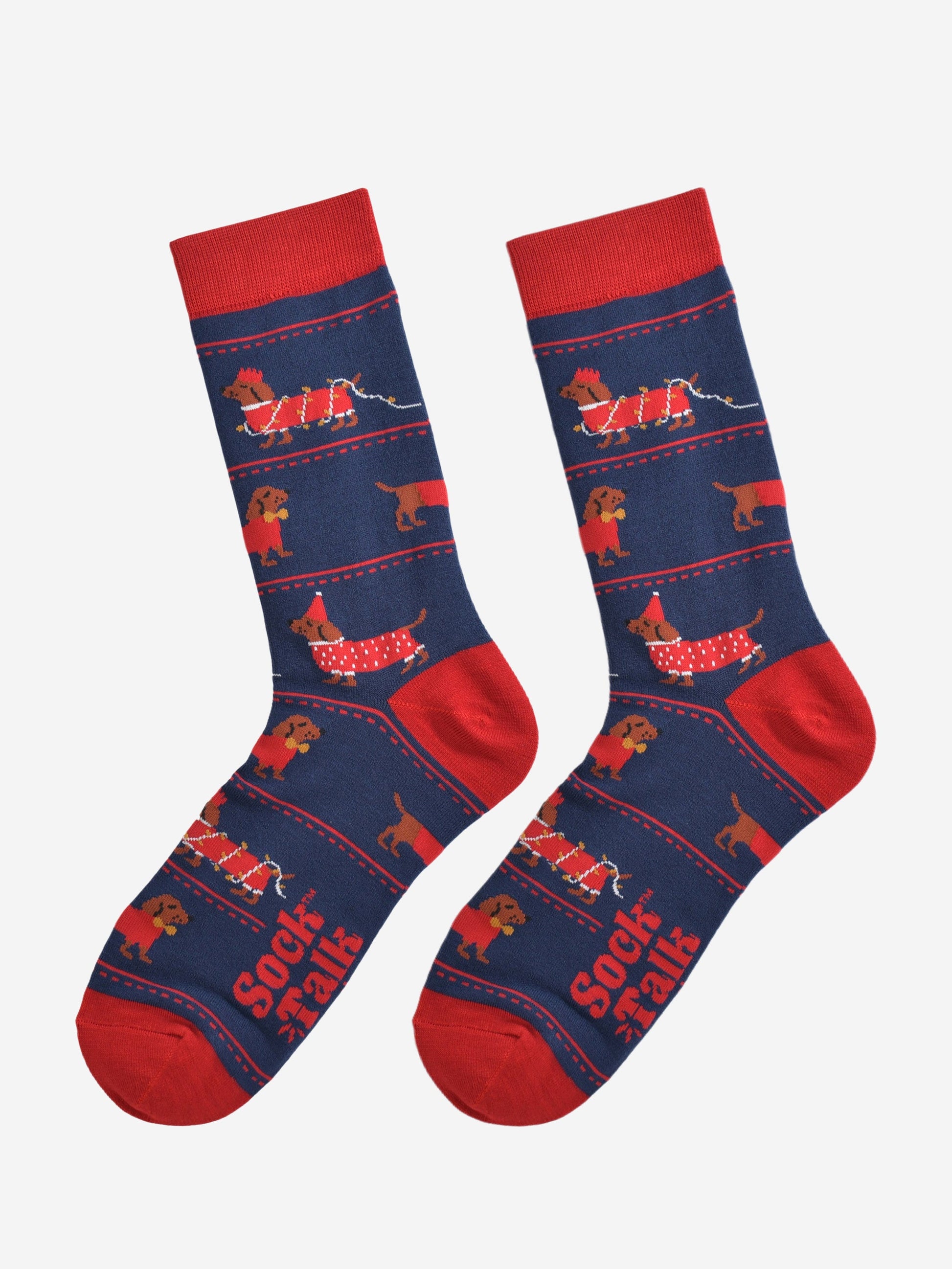 party sausage dog socks laying flat, showing the all over design with the dachshunds wearing red festive coats, party hats and being entangled in the party lights