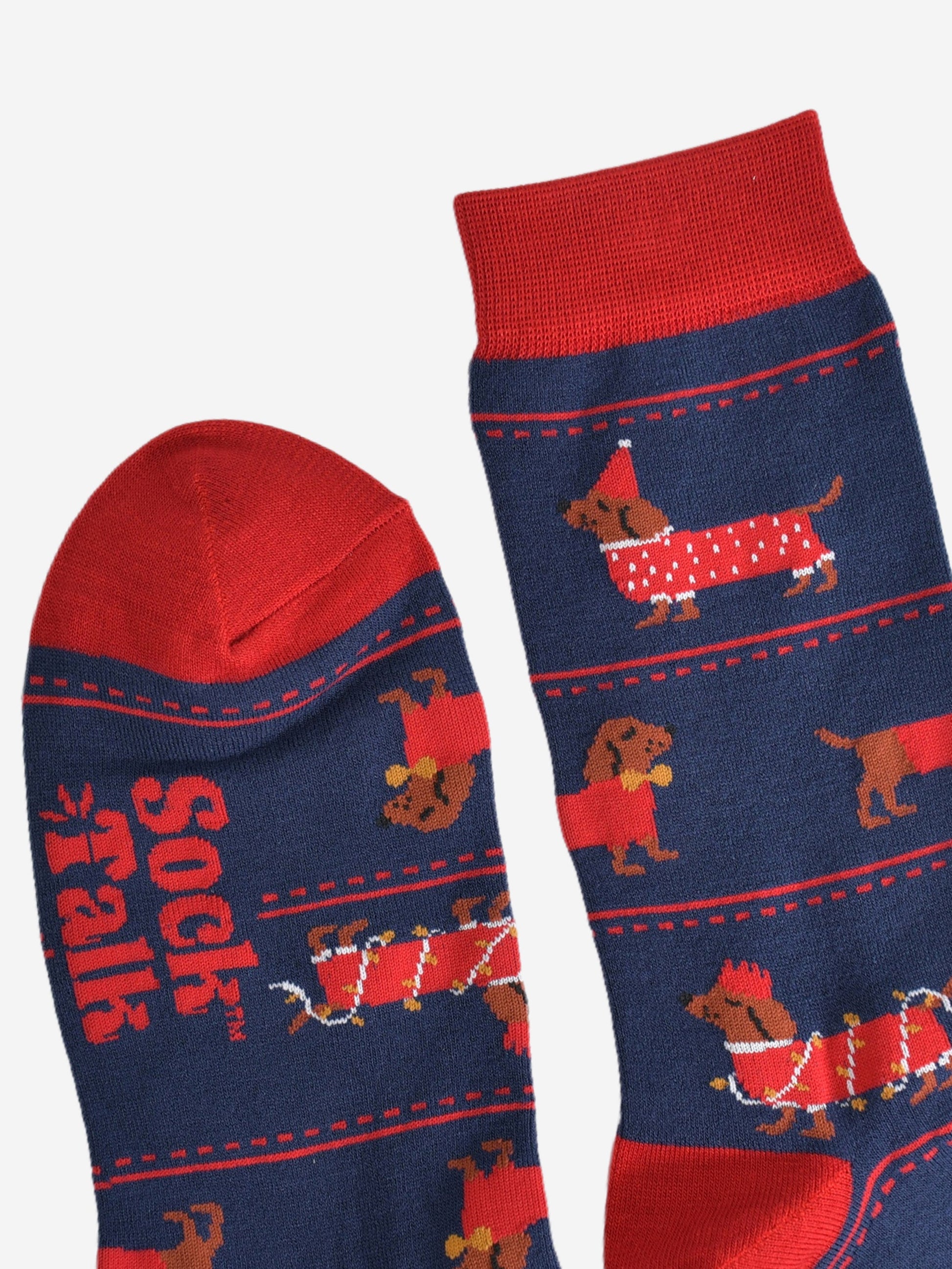 close up of the toe and cuff of the socks, these are red in keeping with the festive party clothing the sausage dogs are wearing, the rest of the socks are navy blue