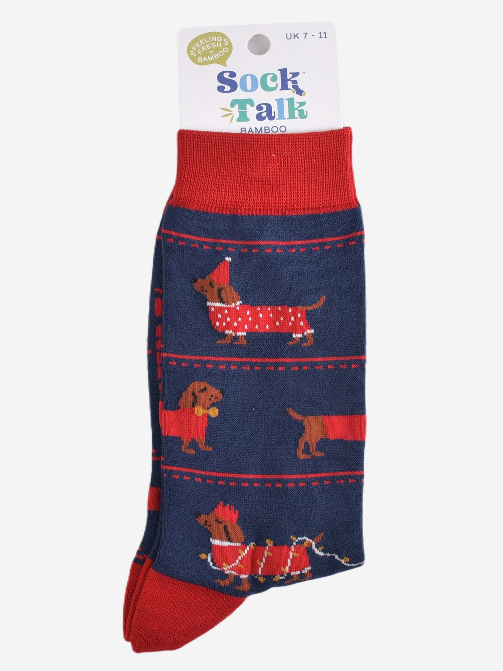 sausage dog party bamboo socks in their sock talk packaging, these socks are a uk size 7-11