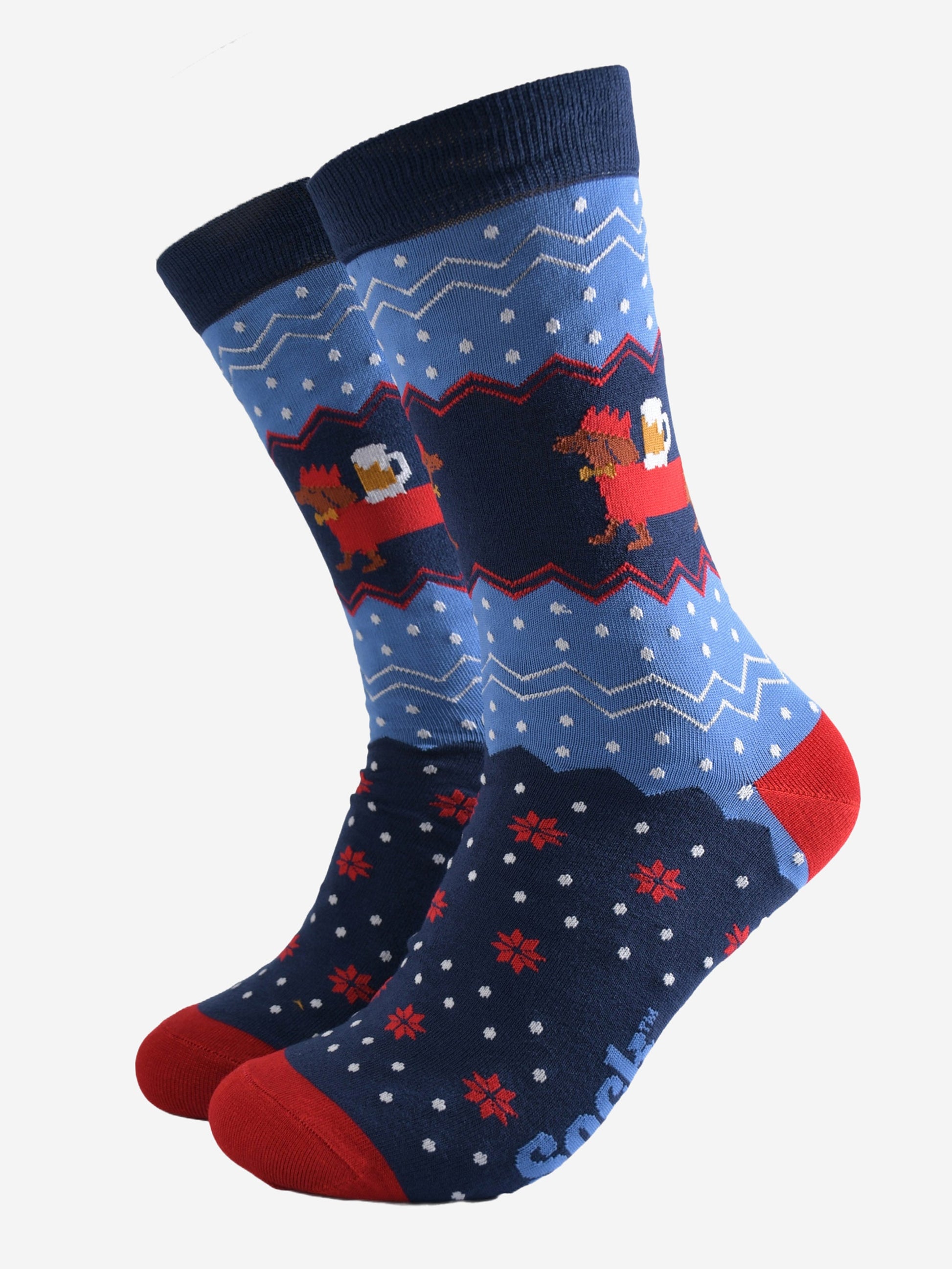 blue and red fair isle style socks with a sausage dog carrying a pint of beer