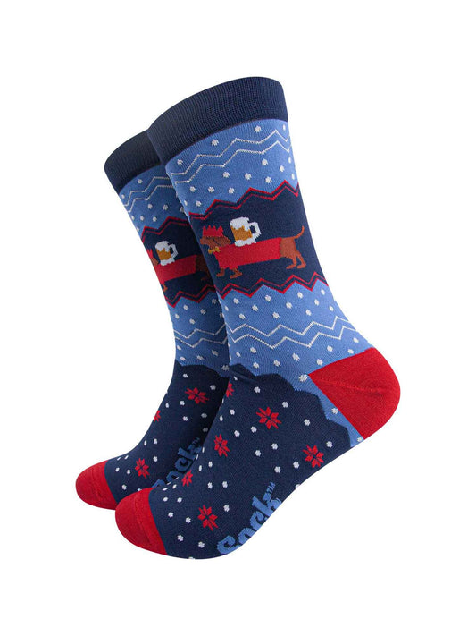 blue and red fair isle style socks with a sausage dog carrying a pint of beer