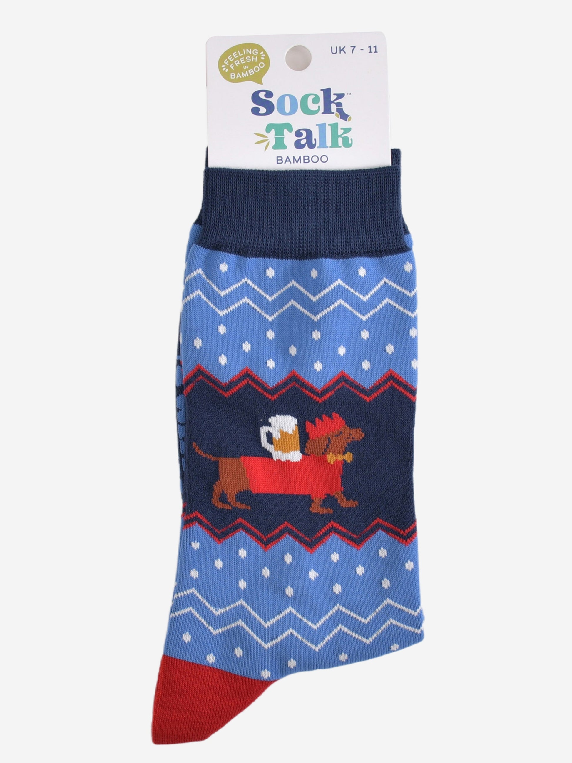 sausage dog carrying a pint of beer bamboo socks in their sock talk packaging, these socks are a uk size 7-11