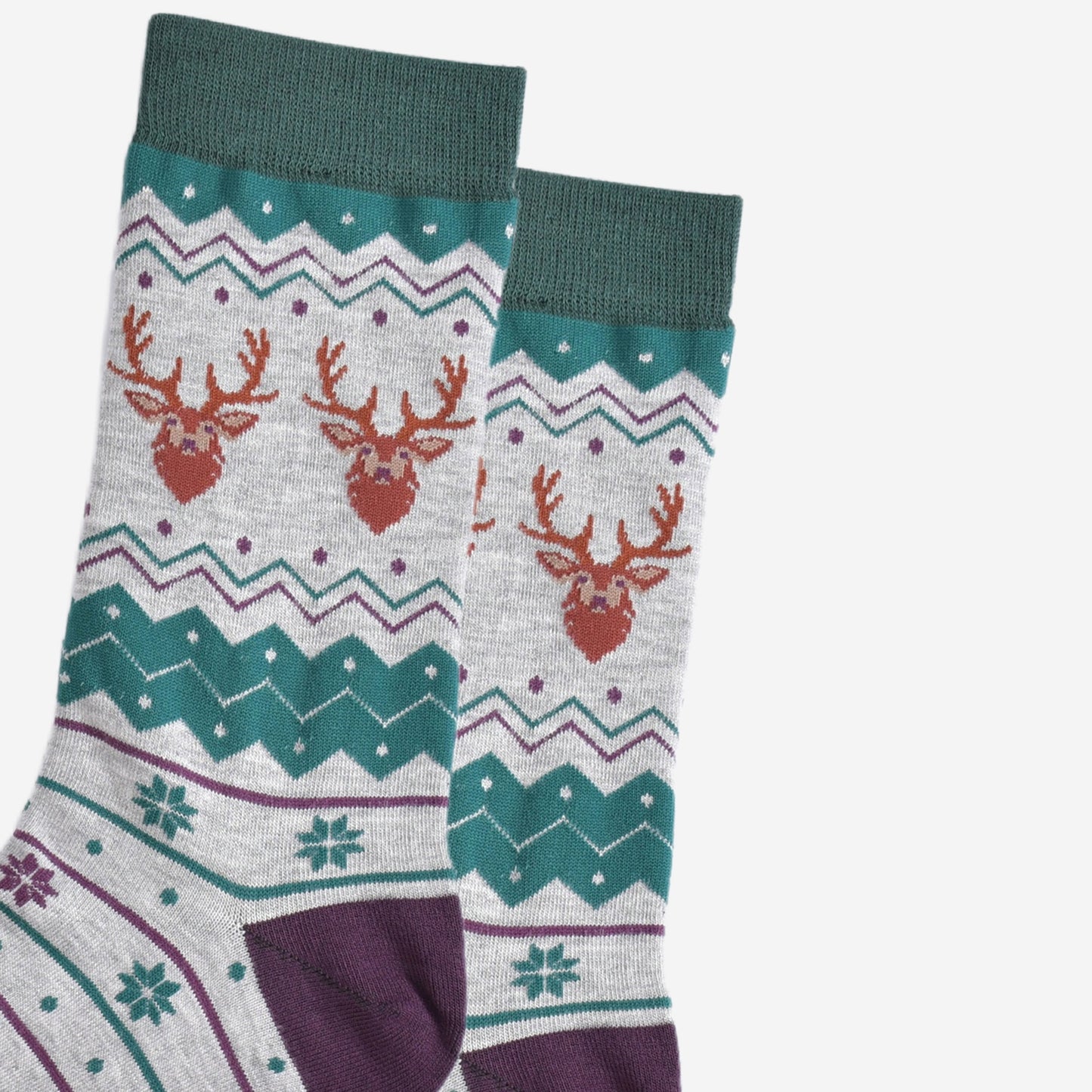 close up of the stag head patterns on the ankles of the socks