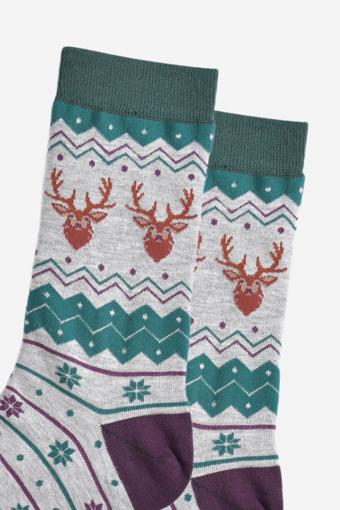 close up of the stag head patterns on the ankles of the socks