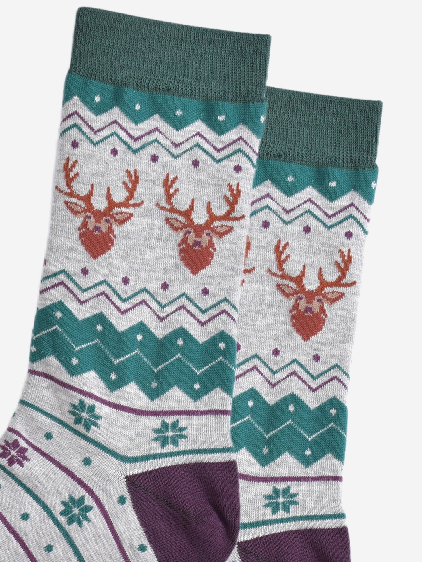 close up of the stag head patterns on the ankles of the socks