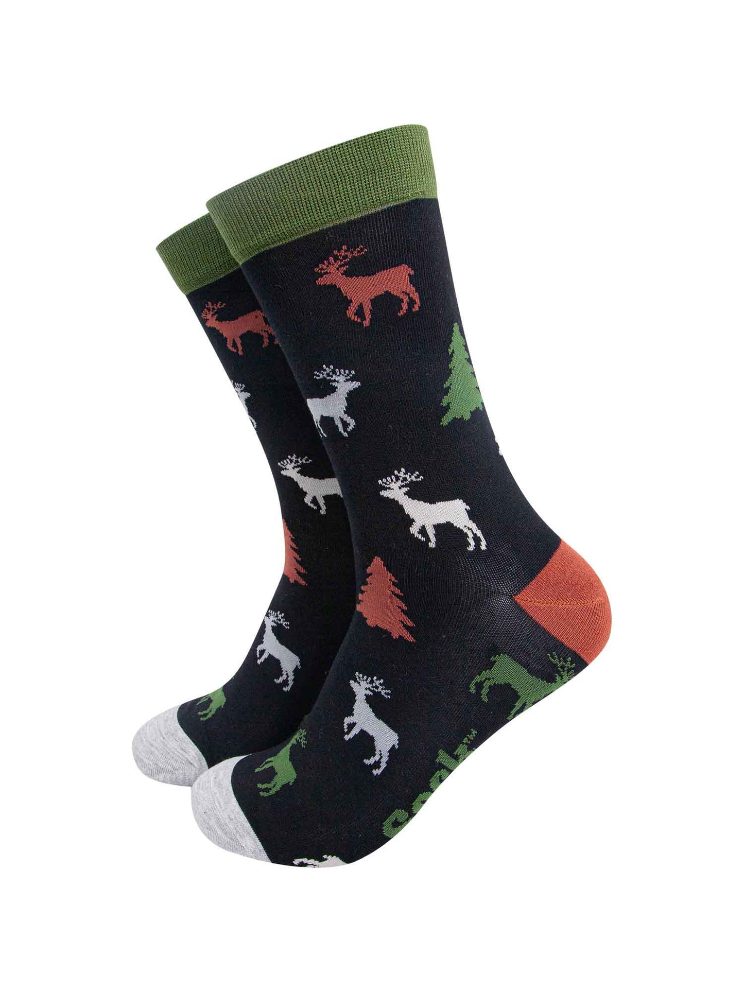 black crew socks with green cuff, grey toe and orange heel with a pattern of stags and christmas trees all over