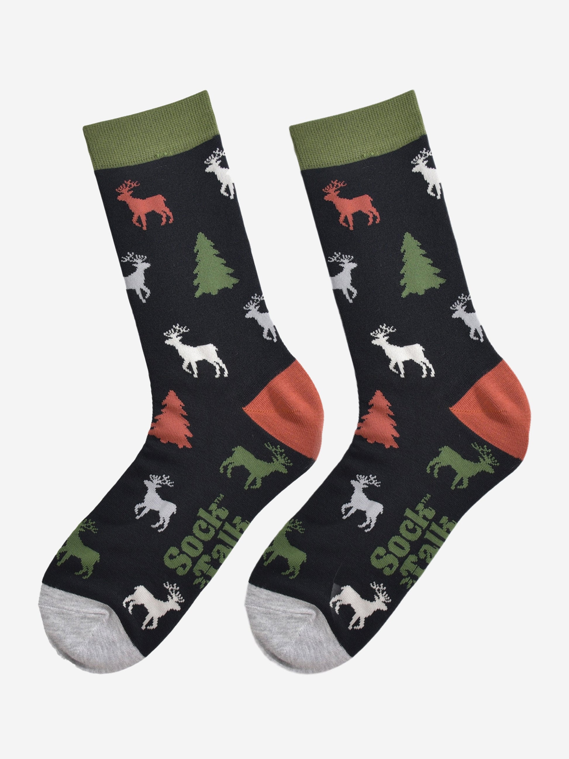showing the stag and christmas tree socks laying flat, the reindeer are orange, green, grey and white, the trees are green and orange all on a black back ground