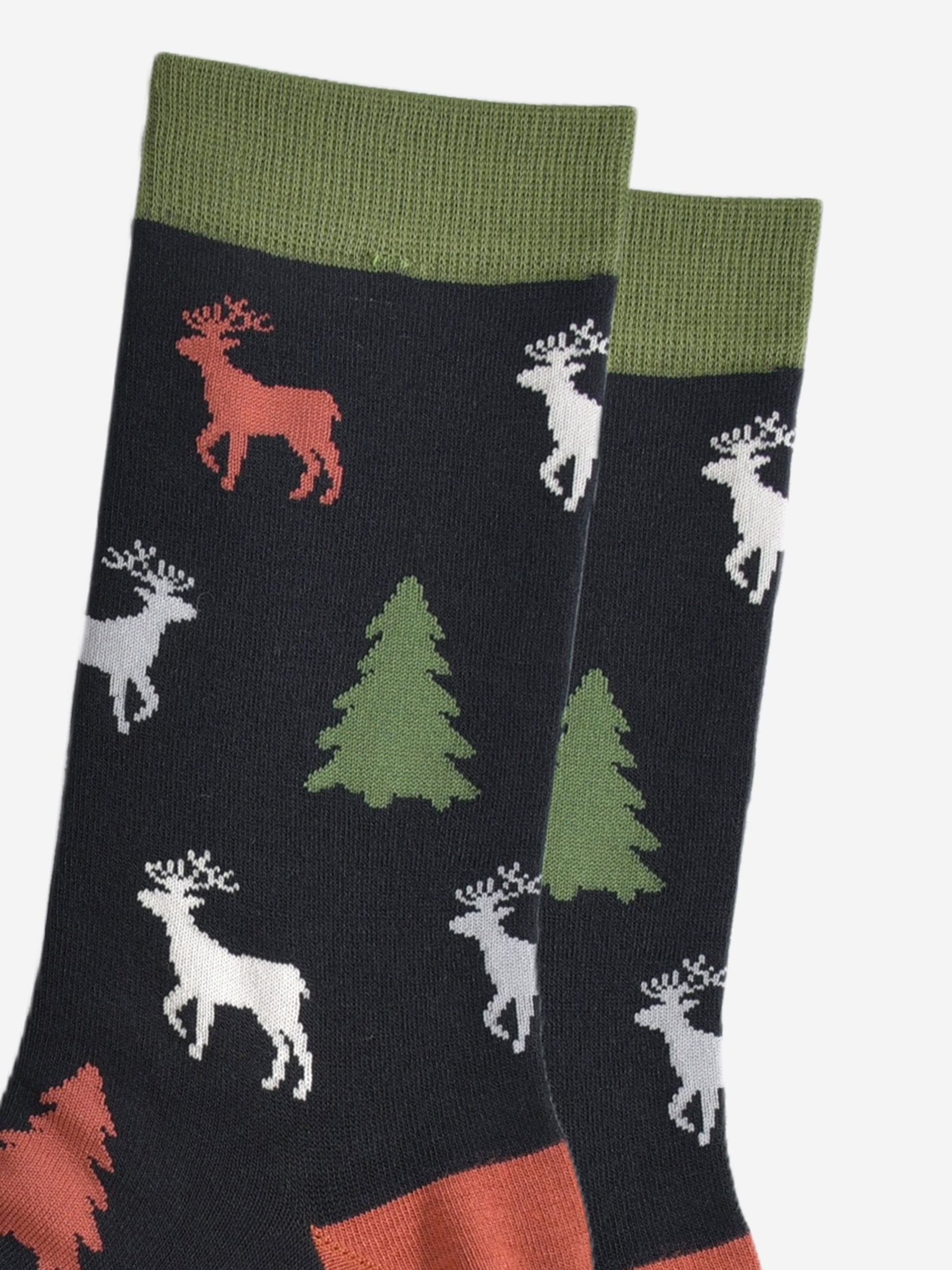 close up of the stag and xmas tree pattern, the stage are stading and profile and have clearly defined antlers