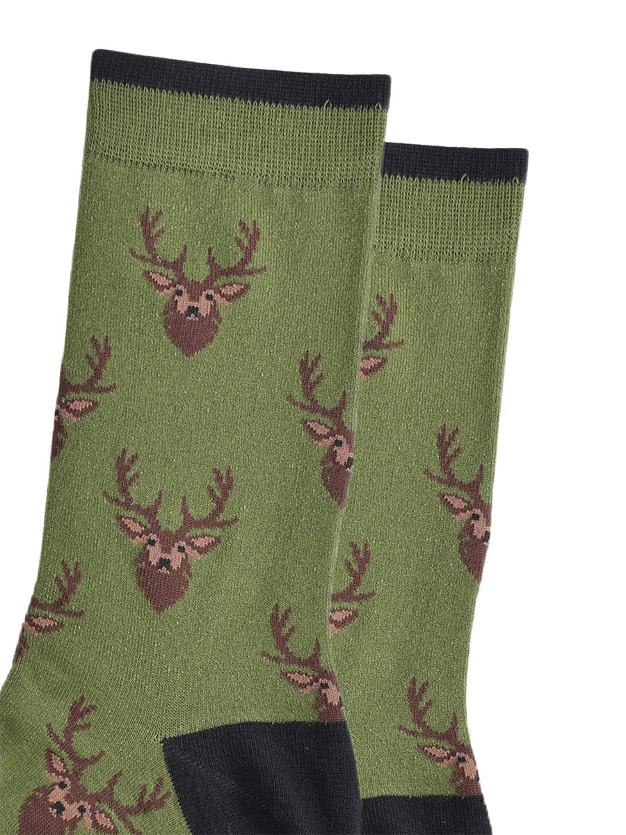 green socks with black heel, toe and cuff with an all over pattern of brown stags heads.