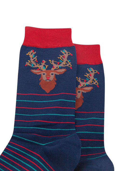close up of the stag head design on the ankle of the socks, showing the festive party lights entangled in its antlers