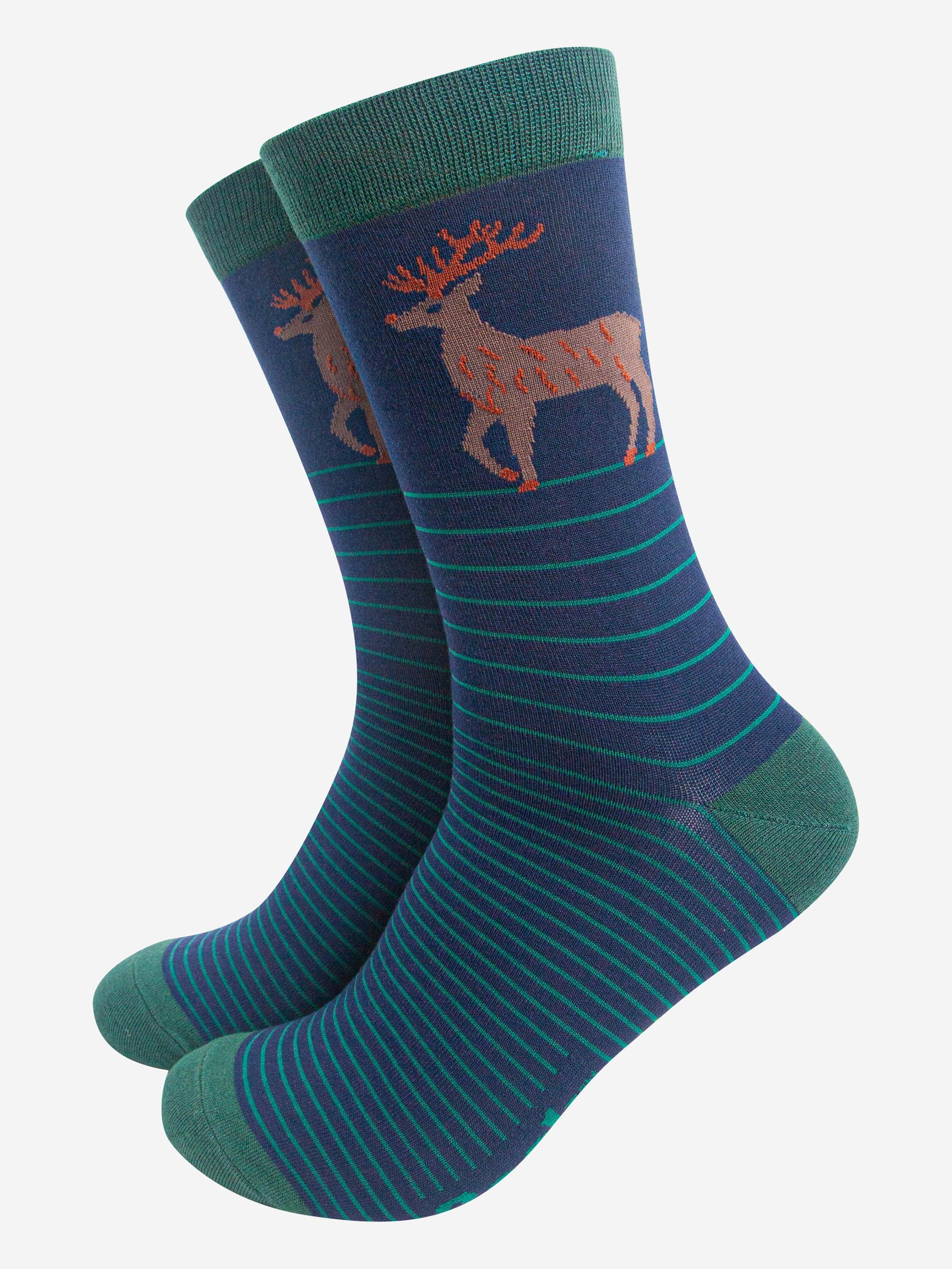 navy blue bamboo crew socks with green stripes and a stag reindeer on the ankle