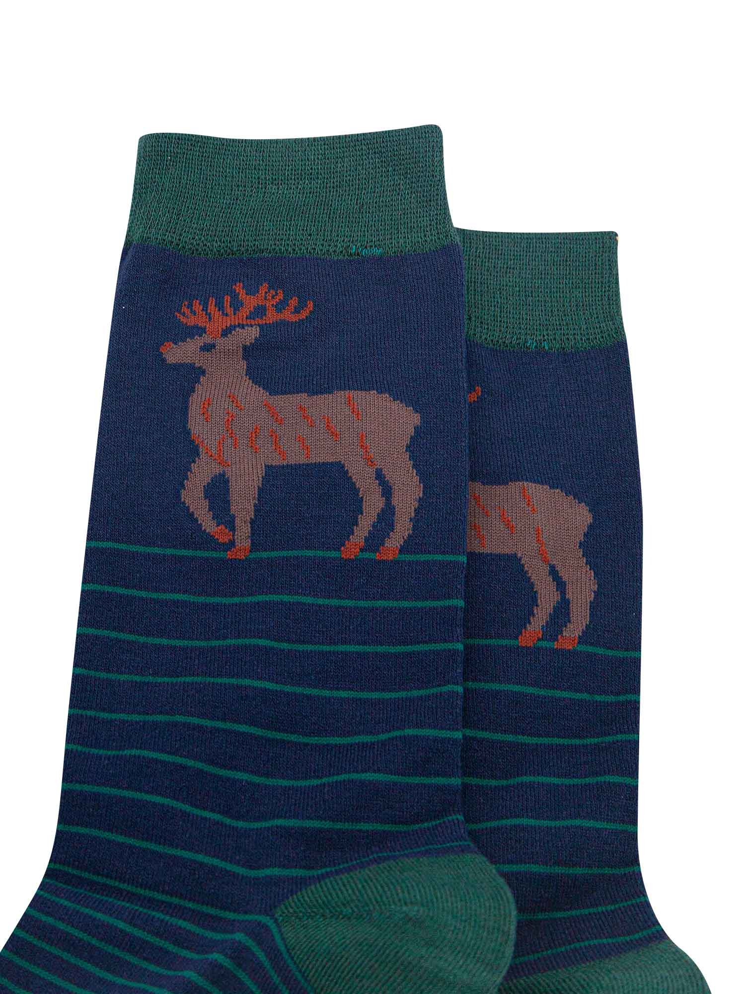 close up of the stag design on the ankle of the socks, the stag is brown with orange antlers
