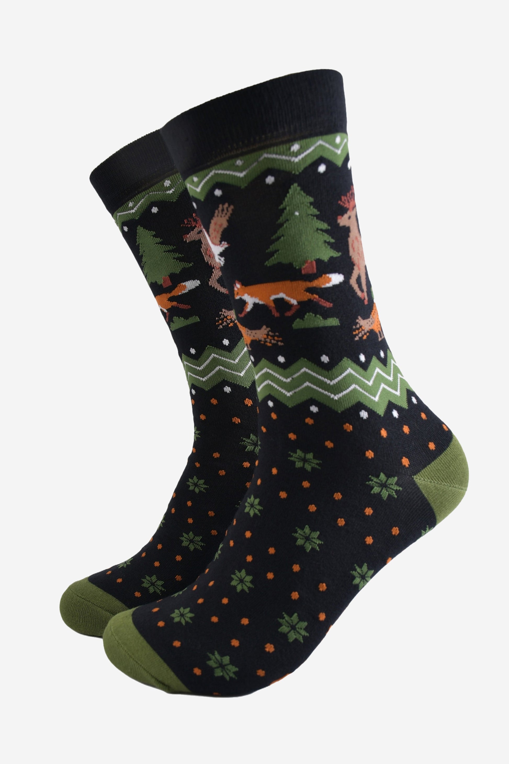 black and green fair isle style crew socks with a woodland animals on the ankle, red foxes, pheasants and stags