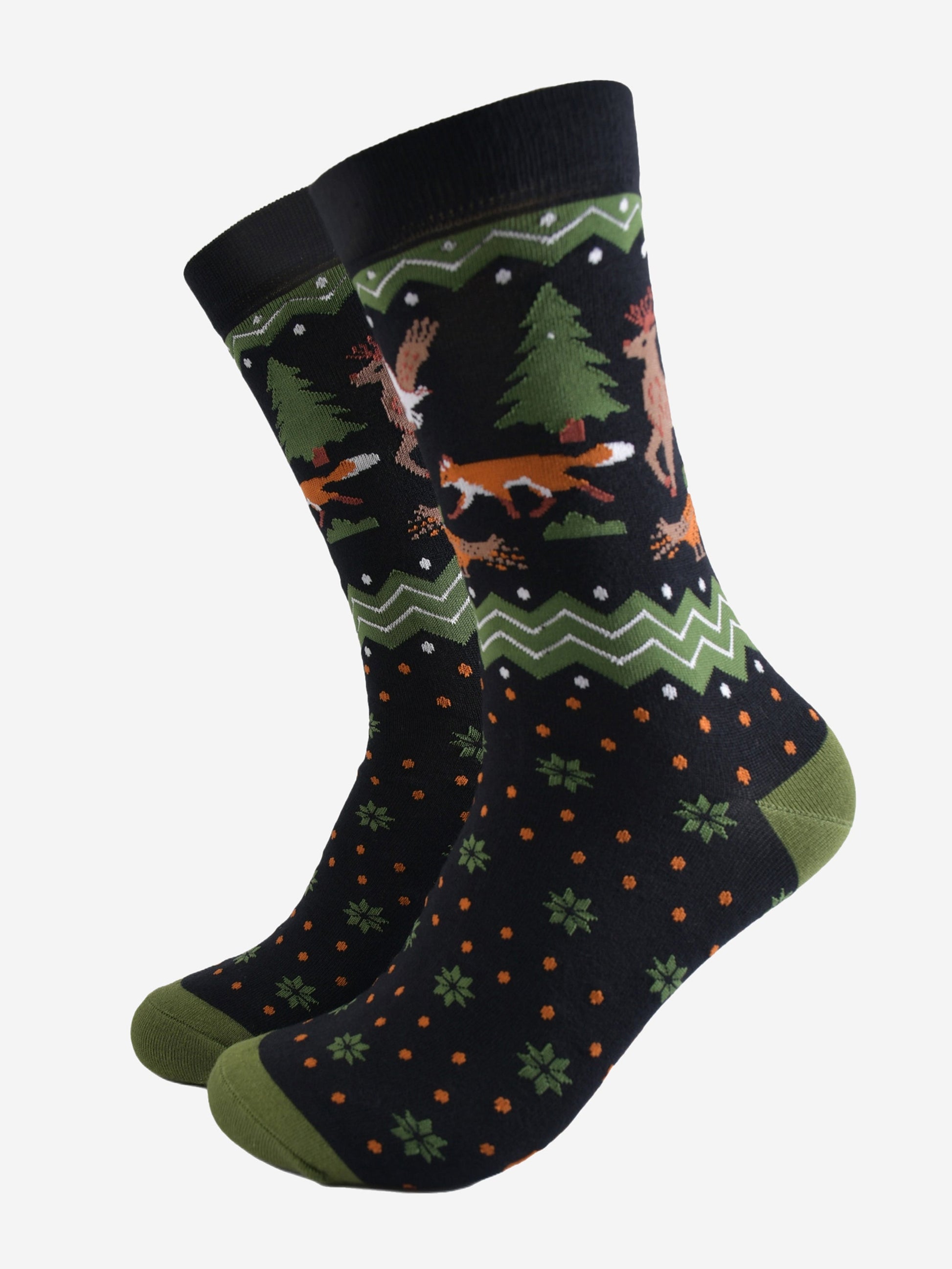 black and green fair isle style crew socks with a woodland animals on the ankle, red foxes, pheasants and stags