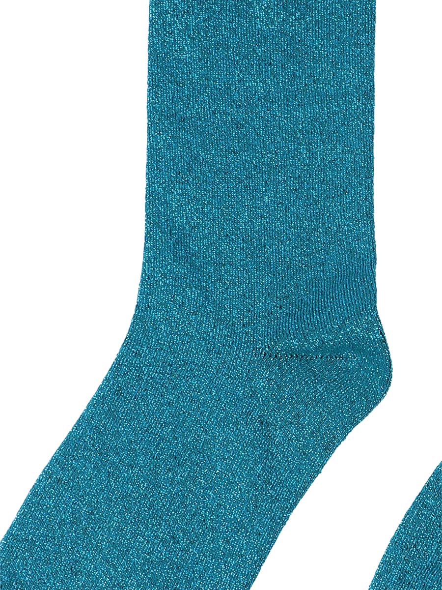 close up of the blue sparkle on these teal knee high socks