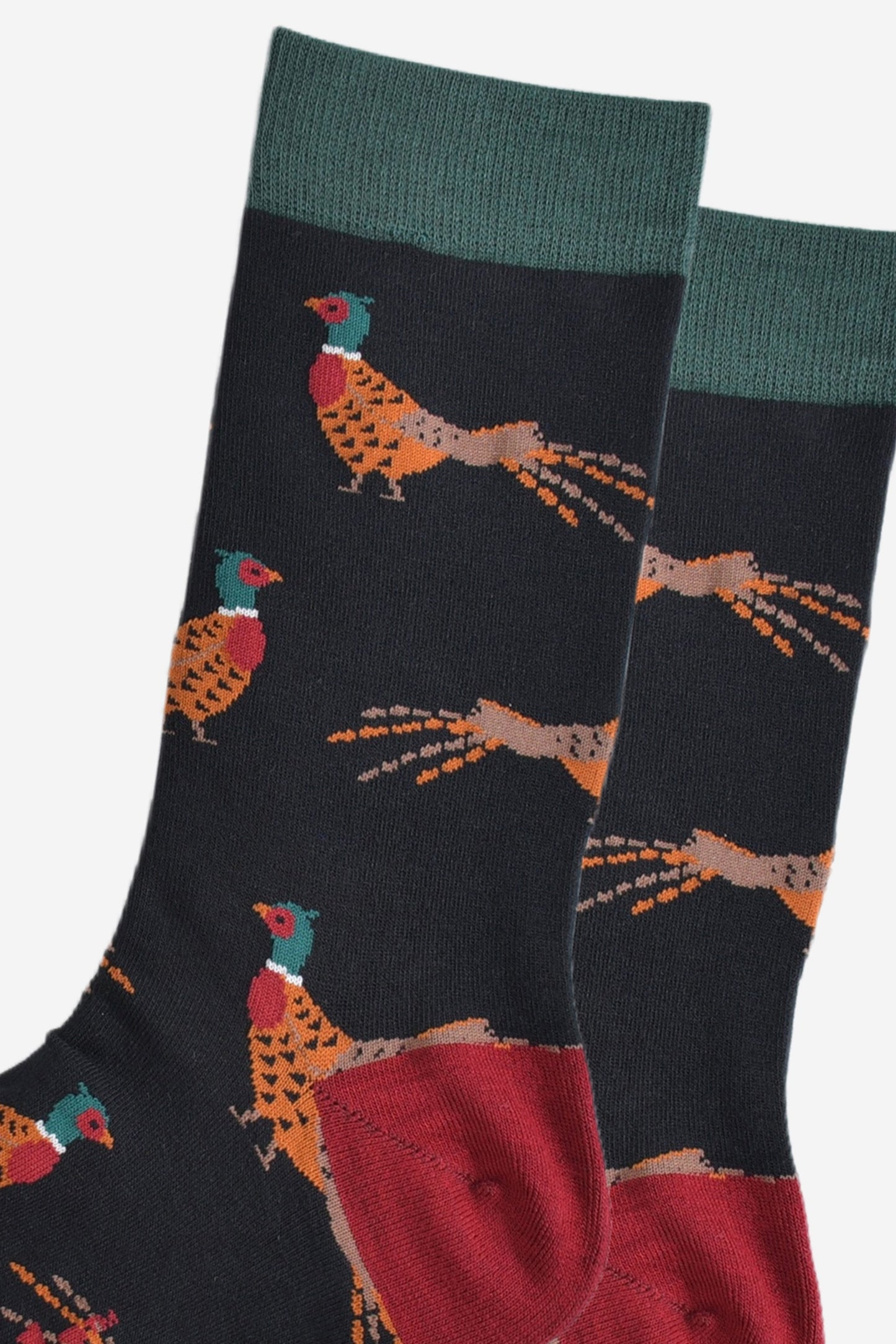 close up of the woodland pheasant pattern on the black bamboo socks, showing the detail of the design