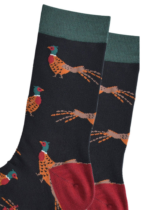 close up of the woodland pheasant pattern on the black bamboo socks, showing the detail of the design