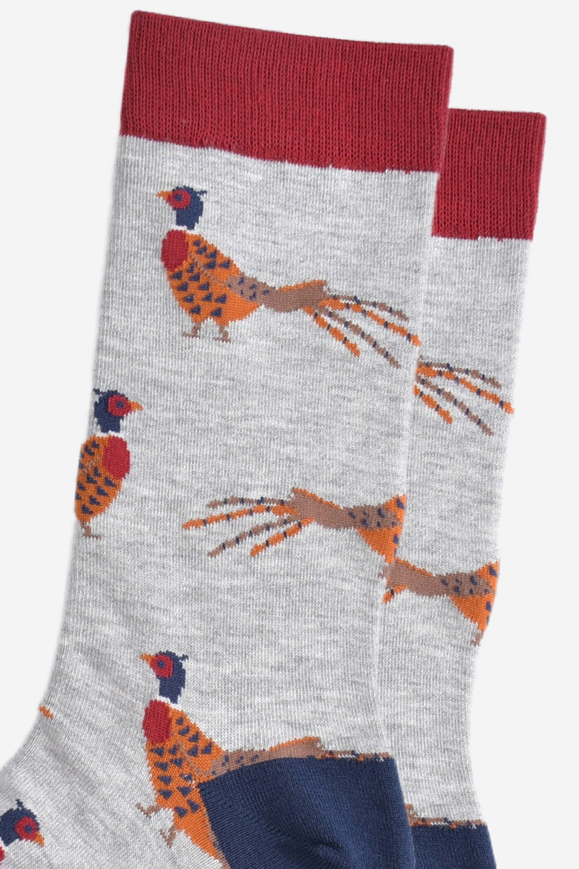 close up of the woodland pheasant pattern on the light grey bamboo socks, showing the detail of the design