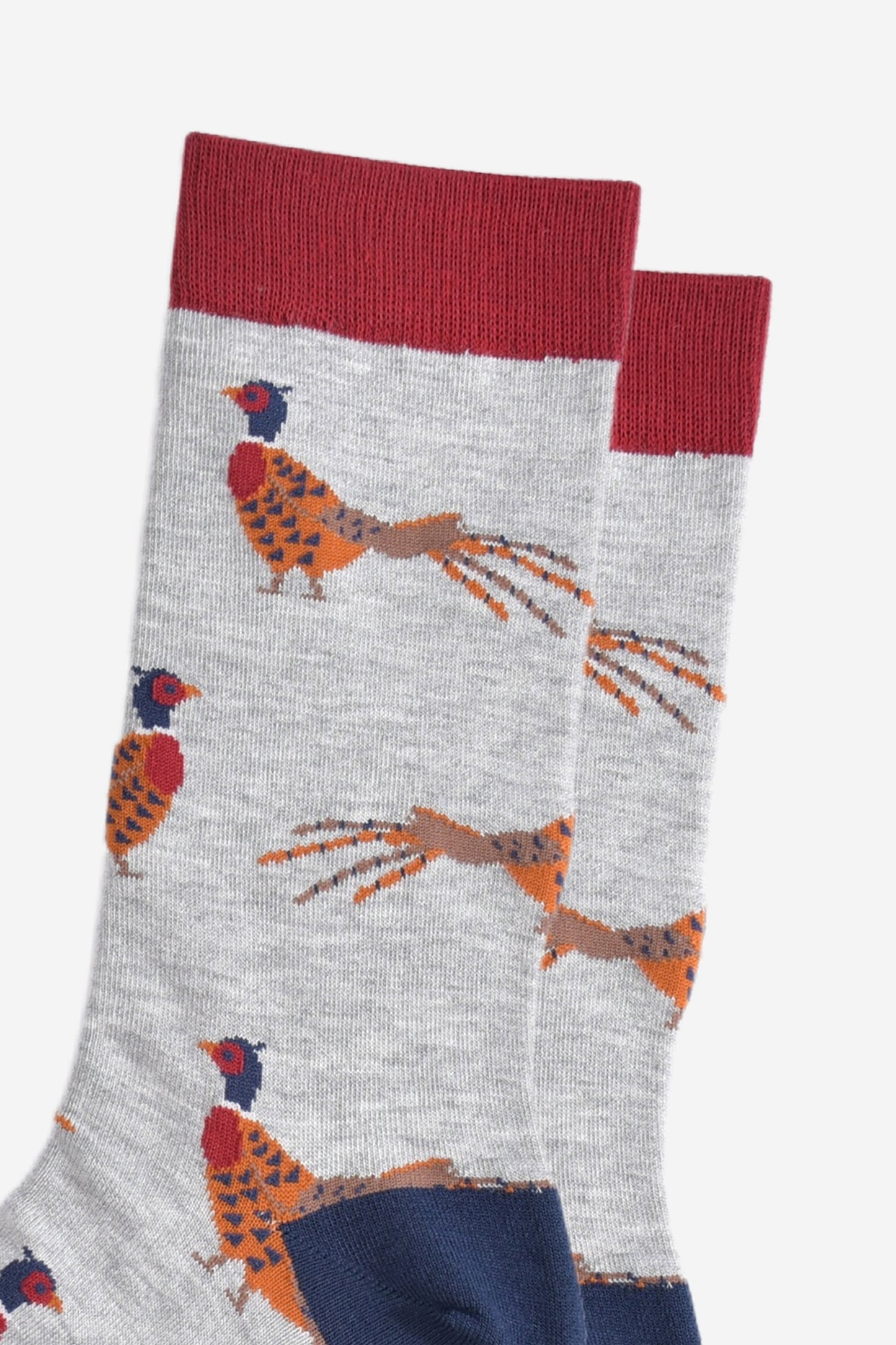 close up of the woodland pheasant pattern on the light grey bamboo socks, showing the detail of the design