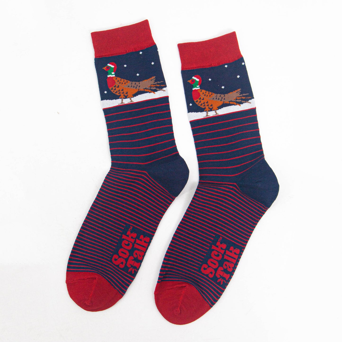 showing the socks laying flat, displaying the red stripe pattern and contrasting christmas pheasant pattern on the ankles