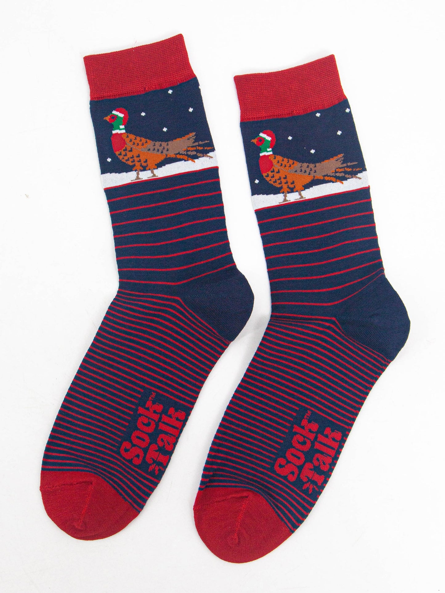 showing the socks laying flat, displaying the red stripe pattern and contrasting christmas pheasant pattern on the ankles