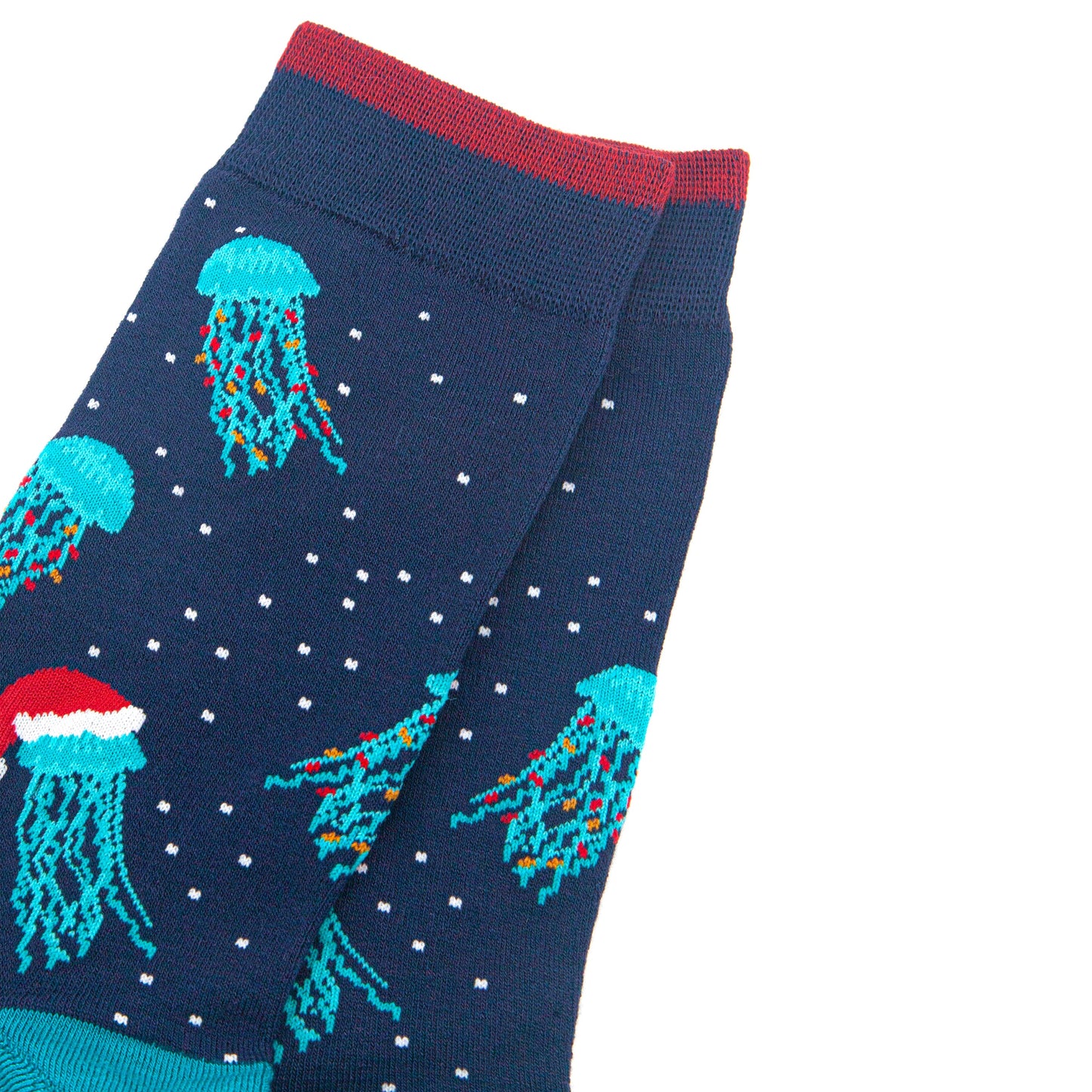 close up of the jellyfish pattern on the sock, they are electric blue with long tentacles, some have colourful party lights entwined in their tentacles, others are wearing red santa hats