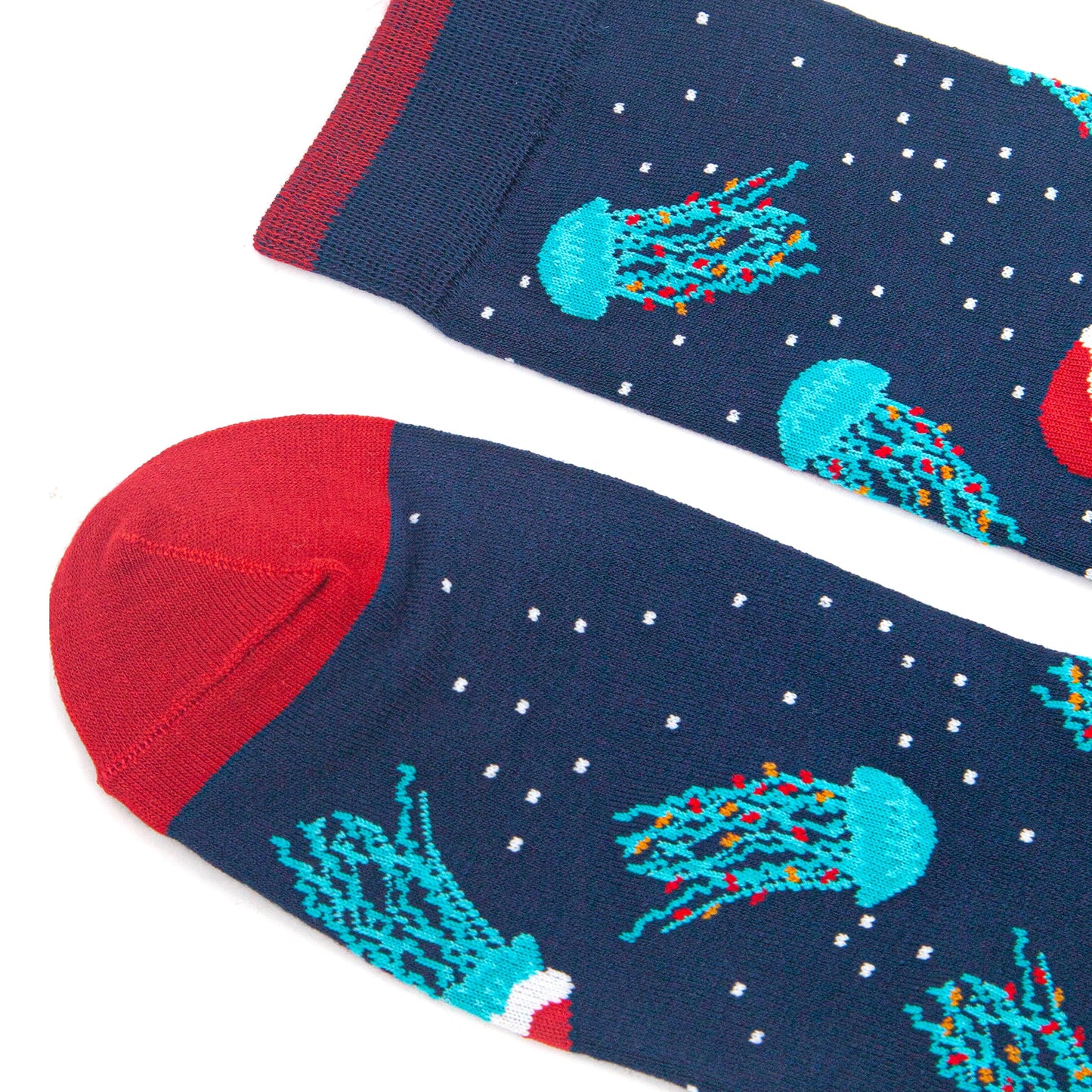 close up of the toe and cuff of the socks, both are red and contrast the navy blue body of the socks