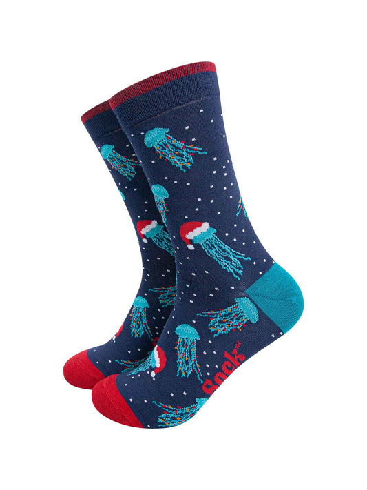 navy blue socks with red toe, cuff and an electric blue heel, there is a pattern of electric blue jellyfish wearing santa hats and party lights all over the socks